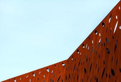 Low angle view of roof against clear blue sky
