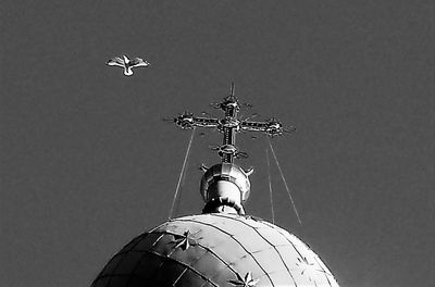 Low angle view of airplane flying against clear sky