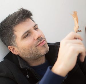 Close-up of young man at home