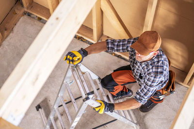 Low section of man working at workshop