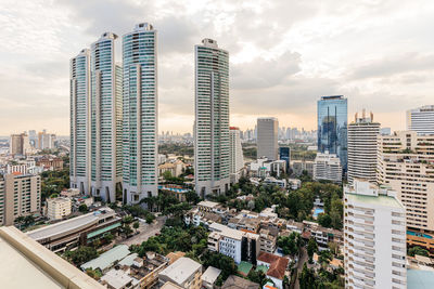 High angle view of modern buildings in city against sky