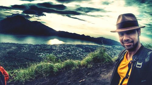 Portrait of smiling man against mountains