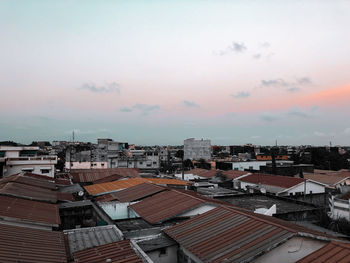 High angle view of buildings in city against sky