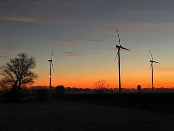 Scenic view of field against sky during sunset