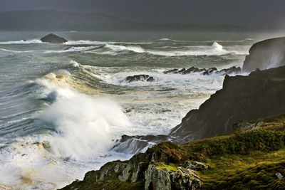 Giant waves breaking on cliffs on a stormy day in corunna, spain