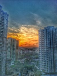 Built structure against sky at sunset