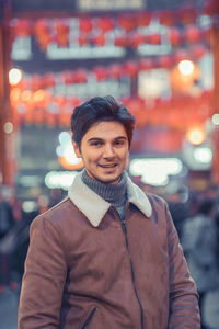 Portrait of smiling man in snow