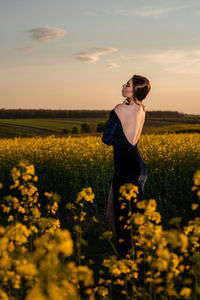 Woman standing on field