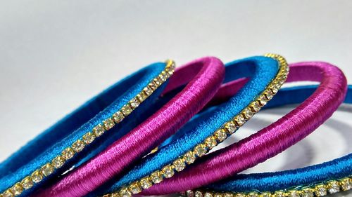 Close-up of bangles on white background