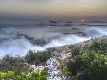 Aerial view of clouds over mountain