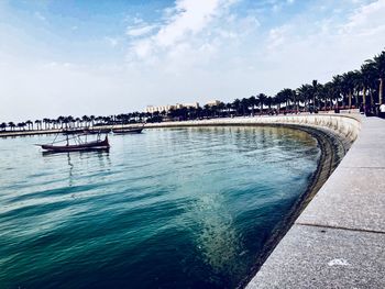 Scenic view of sea against sky in city