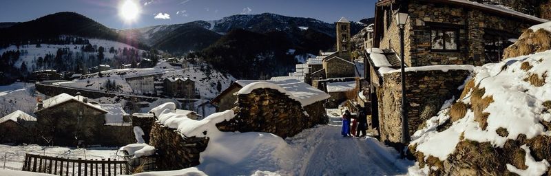 Tourists on snow covered mountain