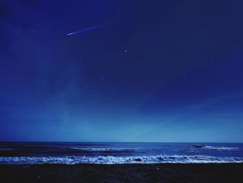 Scenic view of sea against sky at night