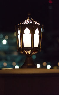 Low angle view of illuminated electric lamp