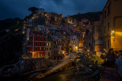 Illuminated buildings in city at night