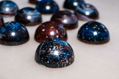 Close-up of multi colored balls on table