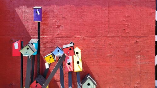 Close-up of birdhouse on wall against building