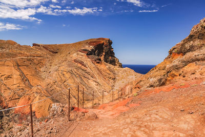 Secured hiking trail through the rocky landscape at sao lourenco bay on madeira island, portugal