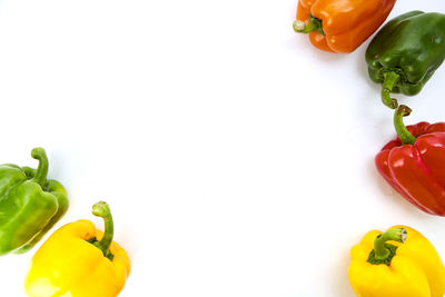 Close-up of bell peppers against white background