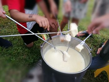 Midsection of people having food