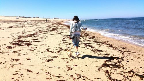 Woman standing on beach