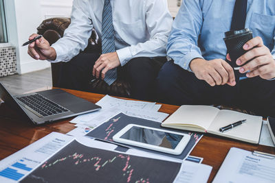 High angle view of business people working on table