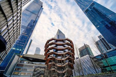 Low angle view of modern buildings against sky