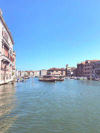 View of buildings in city against clear sky