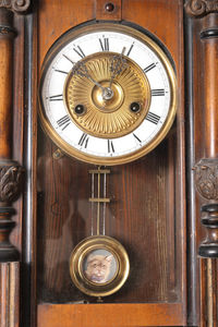 Close-up of clock on door