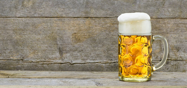 Close-up of beer glass on table