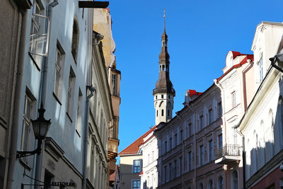 Low angle view of buildings against sky in city