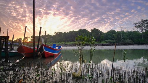 Twin boats at sunrise.