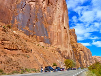 Scenic view of rock against cloudy sky
