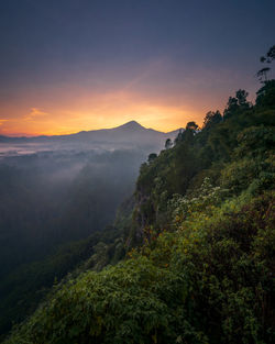 Scenic view of mountains against sky during sunset