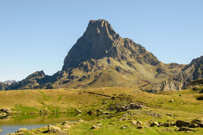 Scenic view of mountains against clear blue sky