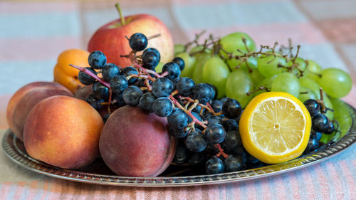 Close-up of fruits in plate on table