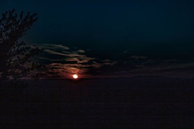 Scenic view of silhouette landscape against sky at sunset