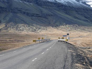 Road leading towards mountain range