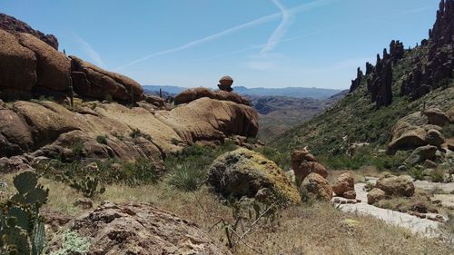 Panoramic view of rocks on landscape against sky