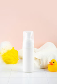 Natural hypoallergenic foam for bathing children. white plastic pump bottle. children's cosmetics.