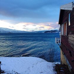 Scenic view of sea against cloudy sky