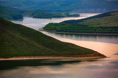 Scenic view of river with mountain in background