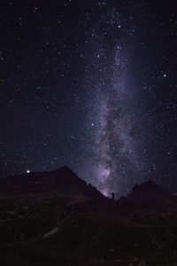 Scenic view of mountain against star field