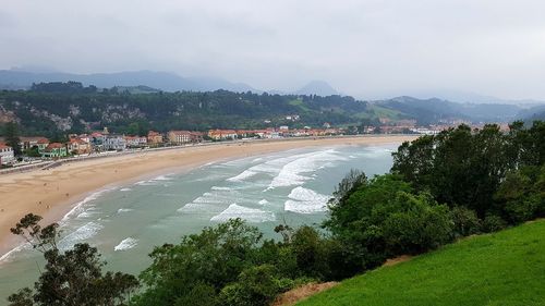 High angle view of river amidst trees against sky