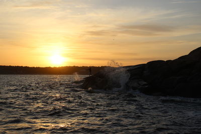 Scenic view of sea against sky during sunset