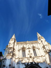 Low angle view of building against blue sky