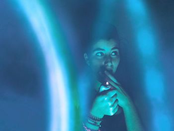 Midsection of man with arms raised