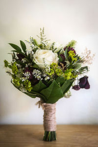 Close-up of various flower bouquet on wooden table