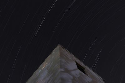 Low angle view of illuminated star field against sky at night