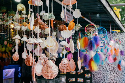Multi colored decorations hanging at store for sale in market